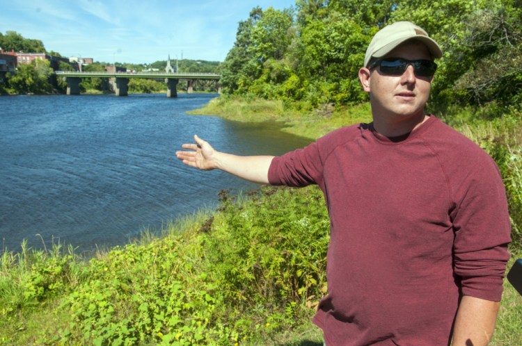 Sean Scanlon, of Dresden, answers questions on Saturday about how he saved a child from drowning in the Kennebec River the evening before in Augusta's East Side Boat Landing.