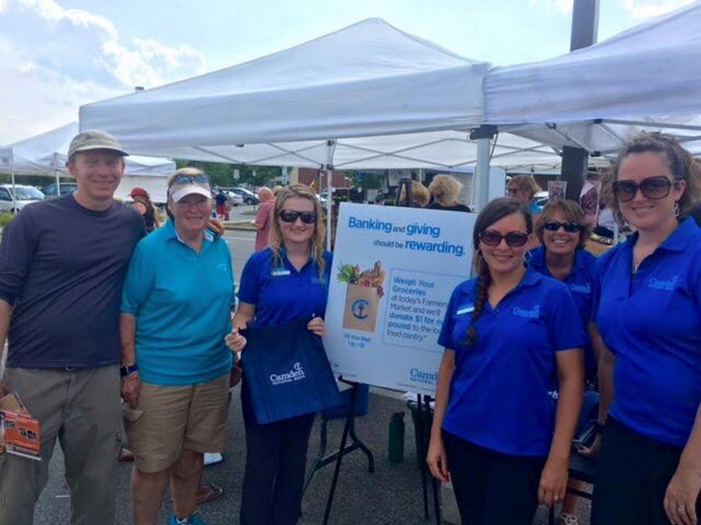 Employees from Camden National Bank in Waterville are joined by representatives from the Waterville Food Bank at one of the August markets. From left are food bank volunteer Nick Smith, operations manager Sandra Hammond, Amber LaPierre, Christina Gagnon and Stephanie Purnell, with Virginia Gleich, in back, from Camden National Bank.