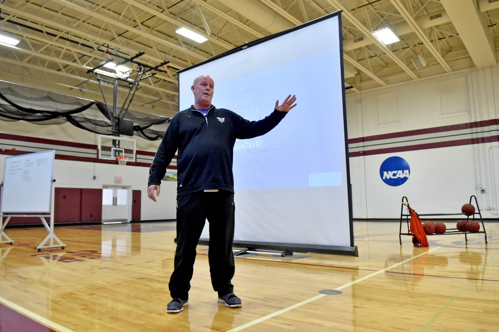 Steve Clifford, head coach of the Charlotte Hornets, speaks to area basketball coaches during a coach's clinic Saturday at Dearborn Gymnasium in Farmington.