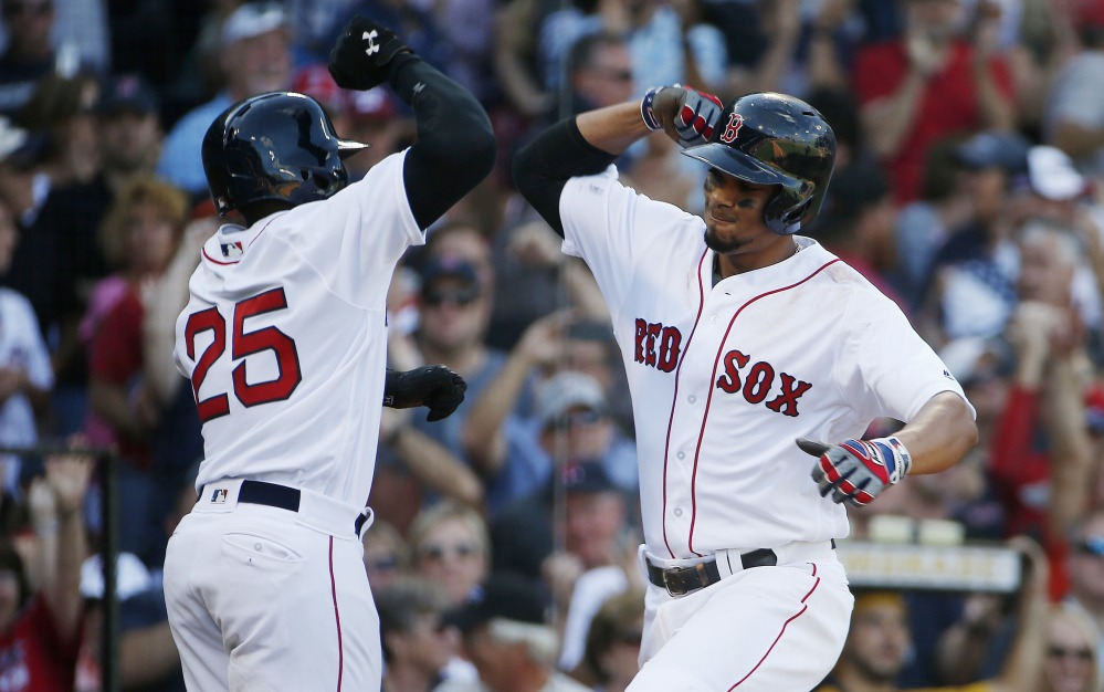 Boston's Xander Bogaerts, right, celebrates his two-run home run that also drove in Jackie Bradley Jr. (25) during the fifth inning against the New York Yankees on Saturday in Boston.