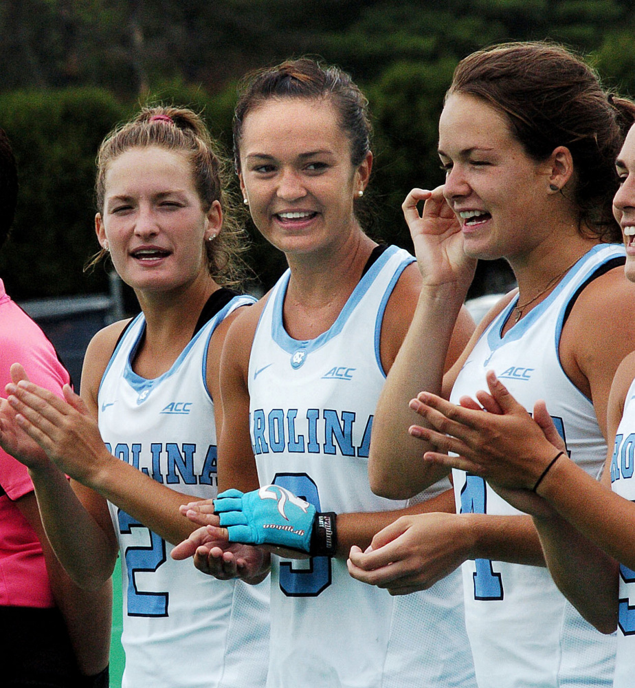 North Carolina's Kristy Bernatchez, center, cheers for teammates as their names are called before a game against the University of Maine on Sunday in Orono.