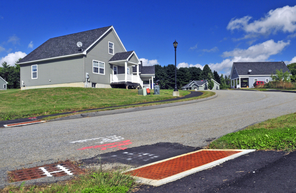 The crosswalks in Augusta's Cony Village development, seen on Tuesday, feature steel plates with truncated domes at the tip-downs to alert the visually impaired about the intersection. City officials are considering a Complete Streets model that encourages considering the needs of all potential users of a street, not just motorists, in the design and development of streets.