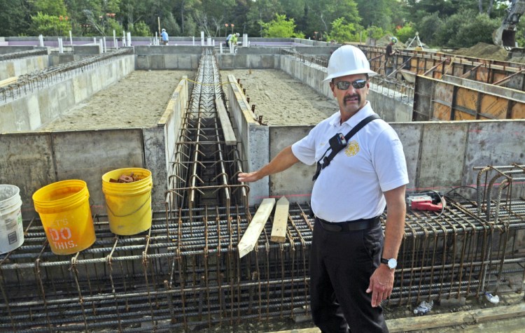 Augusta Fire Chief Roger Audette talks about the foundation of the new fire station being built on Leighton Road in Augusta during a tour of the property Tuesday afternoon.