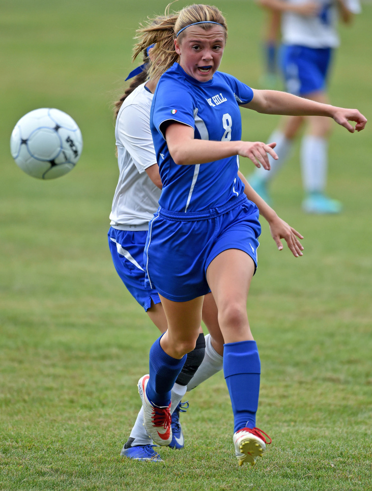 Oak Hill High School's Rylea Mae Swan (8) chases down the ball in Madison on Thursday.