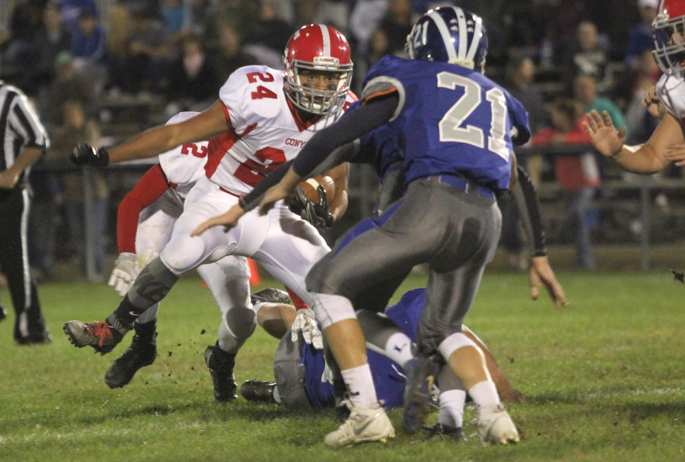 Cony receiver Jordan Roddy is unable to get past Lawrence defensive back Gunner McAllister during a first half run on Friday night in Fairfield.