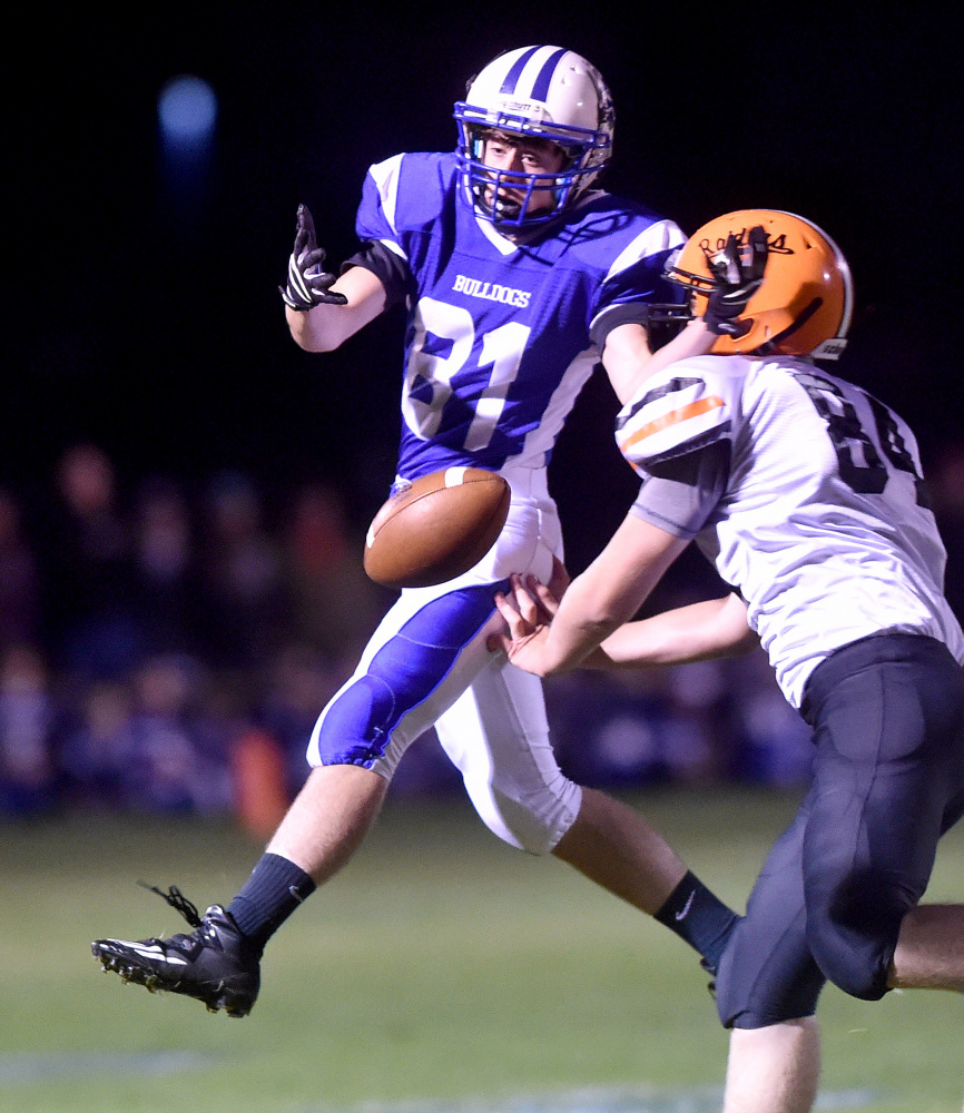 Madison receiver Steven Ouellette (81) can't make the catch as Winslow's Hunter Campbell defends Friday night.