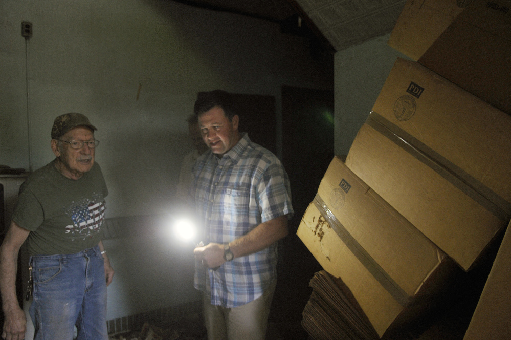 Matt Morrill, right, guides Hallowell resident Burt Truman through a building at the Stevens School Complex in Hallowell during a June 27 tour of the property.