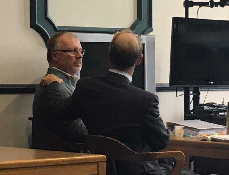 David Brown, left, and his attorney, Allan Lobozzo, react Tuesday after Brown was found not guilty of reckless conduct in connection with a 2014 hayride crash that killed Cassidy Charette, 17, of Oakland.