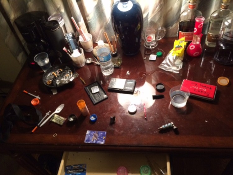 Police say drug paraphernalia, pill bottles, marijuana and syringes were found Friday at a Lovely's Motel room in Palmyra.
