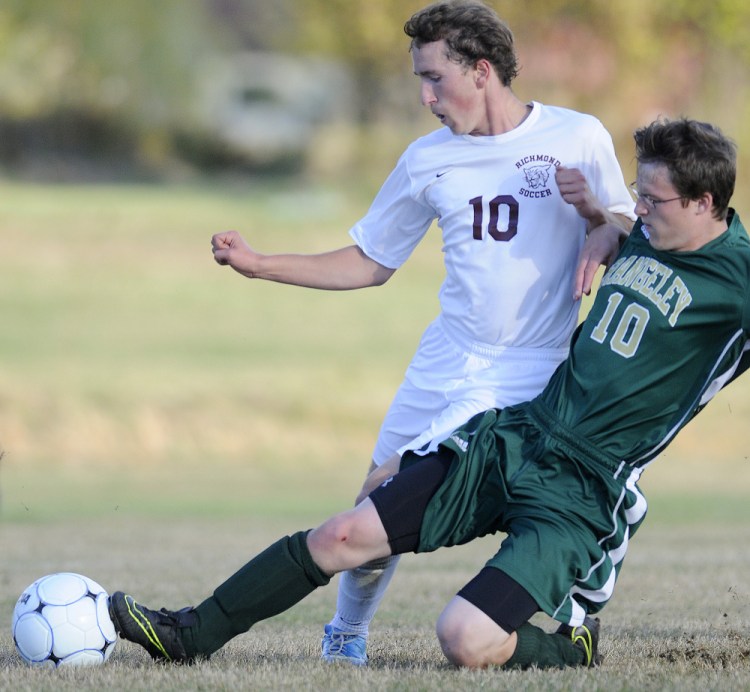 Richmond's Brady Johnson and Rangeley's Bo Beaulieu collide while going after the ball Tuesday in Richmond.