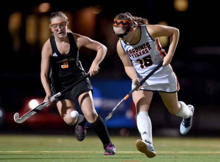 Gardiner's Jillian Bisson (16) battles for the ball with Winslow's Samantha Washburn (3) Tuesday at Thomas College in Waterville.