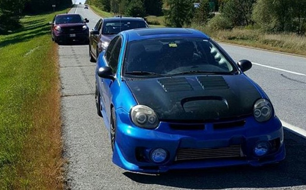 This photo provided by Maine State Police shows a blue Dodge Neon at that police said was clocked driving 146 mph on Interstate 95 north being being pulled over in Pittsfield.