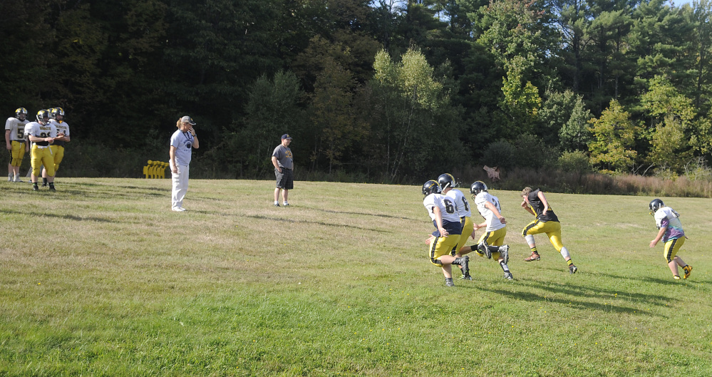 Members of the Maranacook football team works through a drill Tuesday in Readfield.