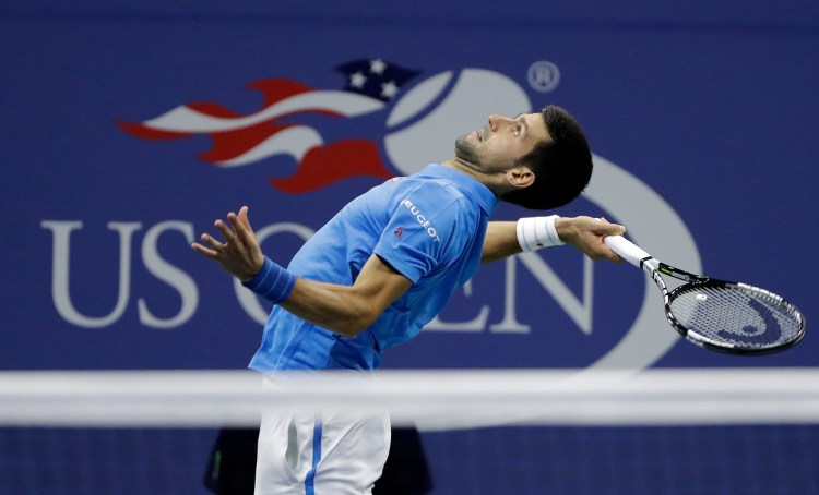 Novak Djokovic serves to Jo-Wilfried Tsonga during the quarterfinals of the U.S. Open on Tuesday.   Associated Press/Darron Cummings