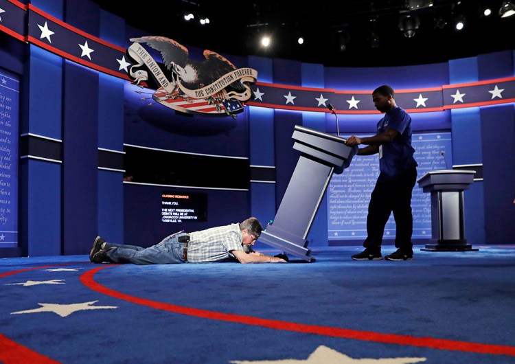 Technicians set up the stage for the presidential debate between Democratic presidential candidate Hillary Clinton and Republican presidential candidate Donald Trump at Hofstra University Sunday,<em>Patrick Semansky</em>