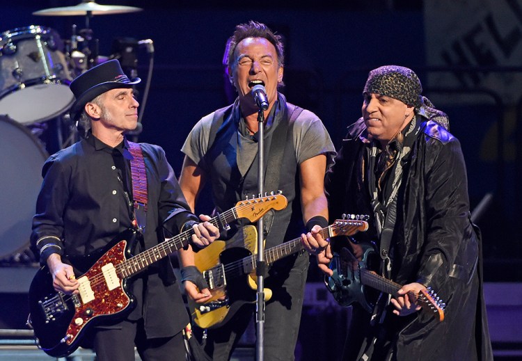 Bruce Springsteen performs with Nils Lofgren, left, and Steven Van Zandt of the E Street Band during a  March 15 concert in Los Angeles. Springsteen's 75-show U.S. and European The River Tour wraps up with a show in Foxborough, Massachusetts, on Sept. 14. <em> Chris Pizzello/Invision via AP</em>