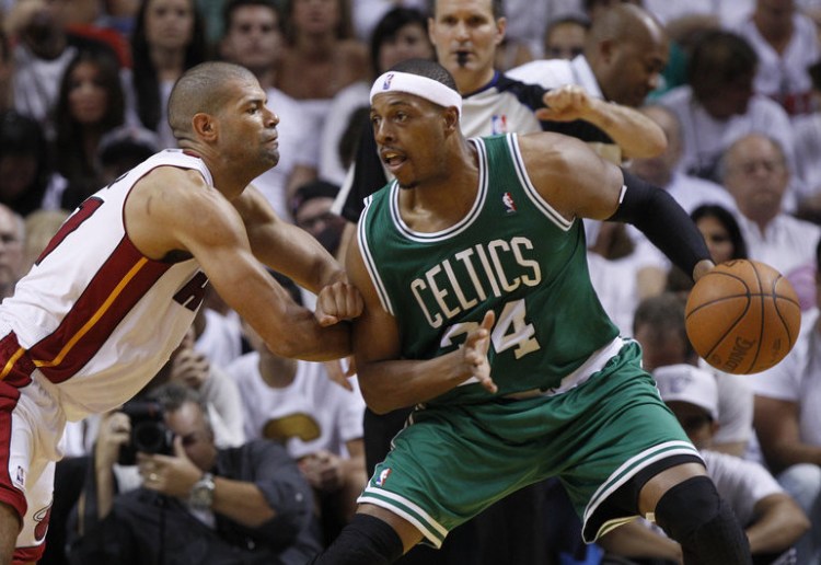 Paul Pierce of the Boston Celtics maneuvers his way to the basket around Shane Battier of the Miami Heat in this 2014 photo. 