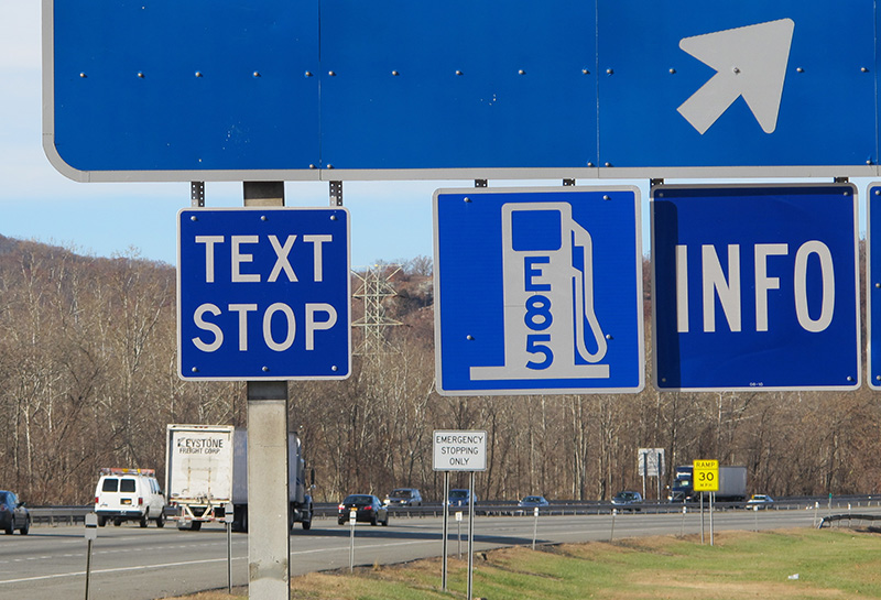 A "text stop" notification on a sign for a service area on the New York State Thruway was part of a state crackdown on texting in 2013.