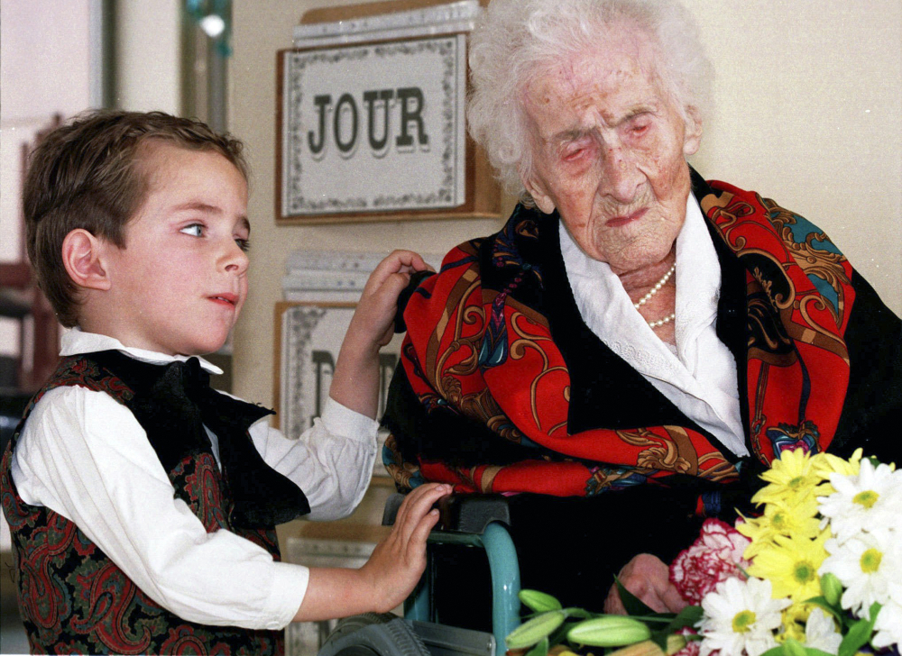 Jeanne Calment died in France at the age of 122 in 1997. Shown receiving flowers from a boy that year, she attributed her longevity to a diet rich in olive oil, wine and chocolate.