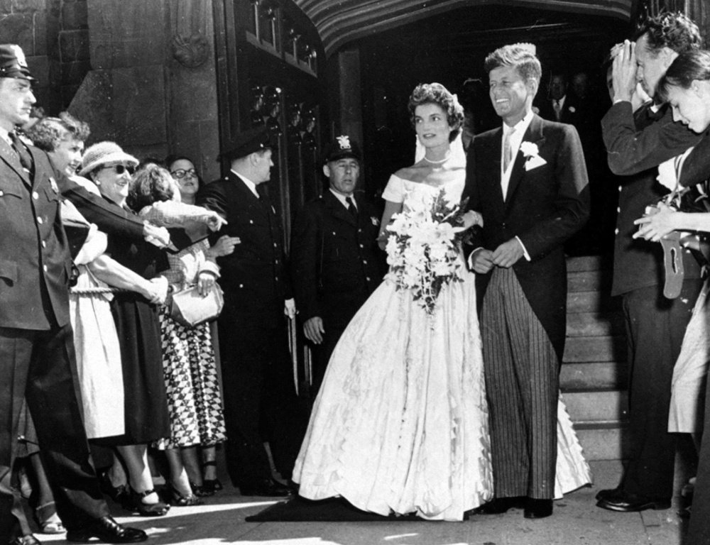 Then-Sen. John F. Kennedy, D-Mass., leaves St. Mary's Church with his bride, the former Jacqueline Bouvier, after their wedding in Newport, R.I., on Sept. 12, 1953.