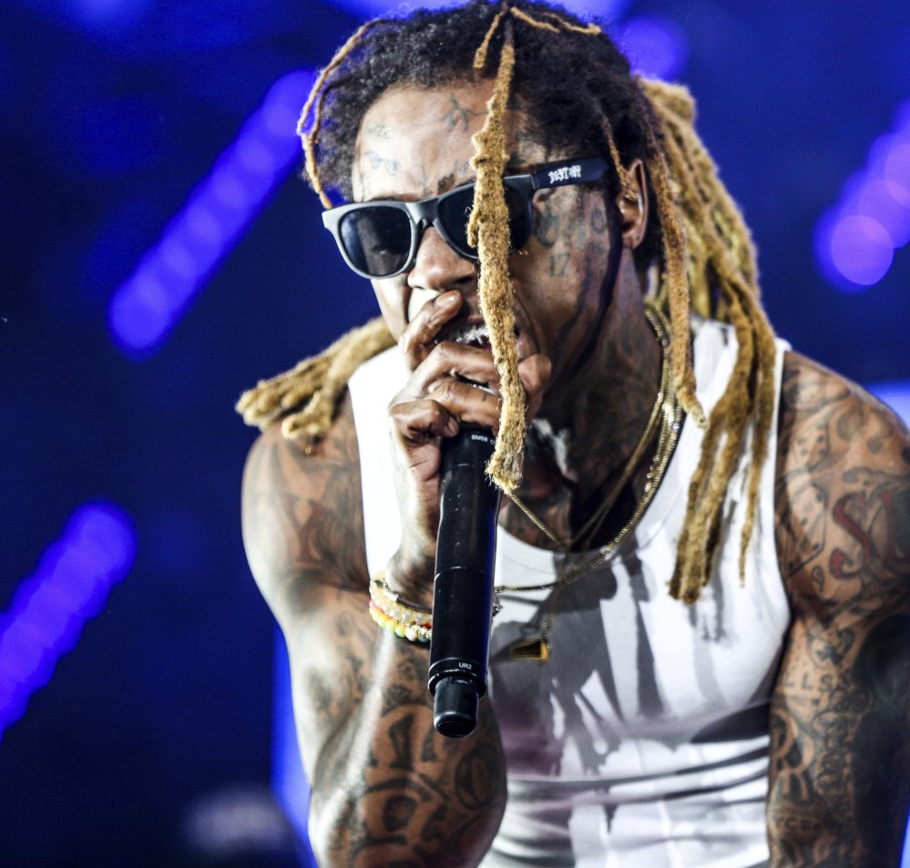 Grammy-winning rapper Lil Wayne says a white officer saved his life when he was 12 after he accidentally shot himself in the chest.