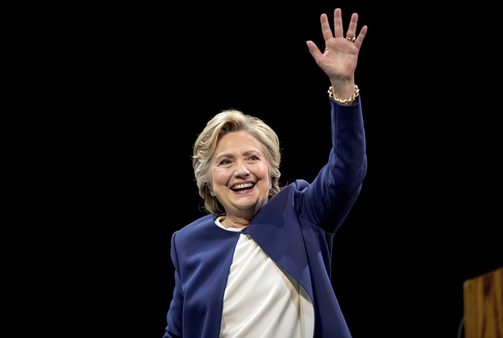 Democratic presidential candidate Hillary Clinton waves after speaking at the Civic Center Auditorium in San Francisco on Thursday. Recent leaks of her Wall Street speeches have fed into talk about there being a public and private Clinton.