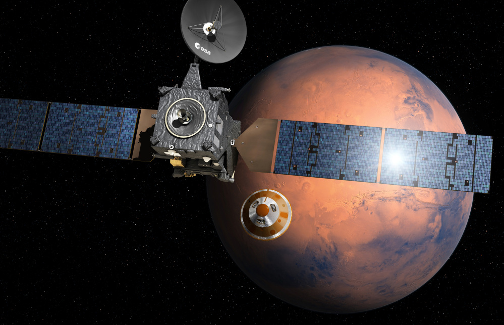 An artist's impression depicts the Schiaparelli, center, as it separates from the mother ship and heads for Mars. NASA has placed several robotic vehicles on the planet.
