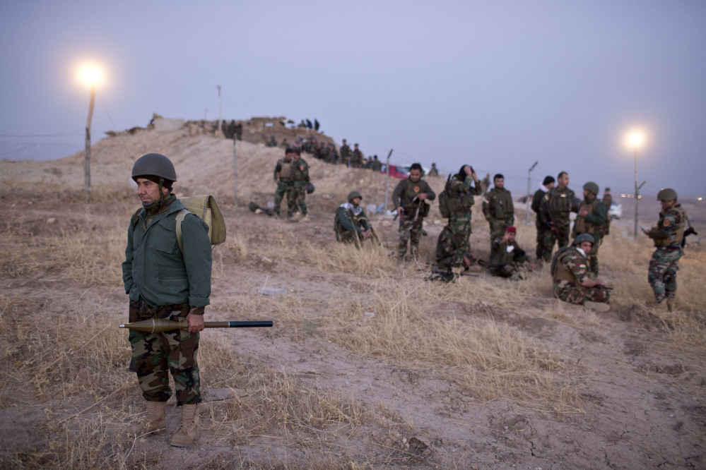 Kurdish peshmerga forces gather prior to opening up a front against the Islamic State in Nawaran, some 13 miles northeast of Mosul, Iraq, on Thursday. Peshmerga are launching an offensive to take the villages on the Nawaran mountain, pulling closer to Mosul.