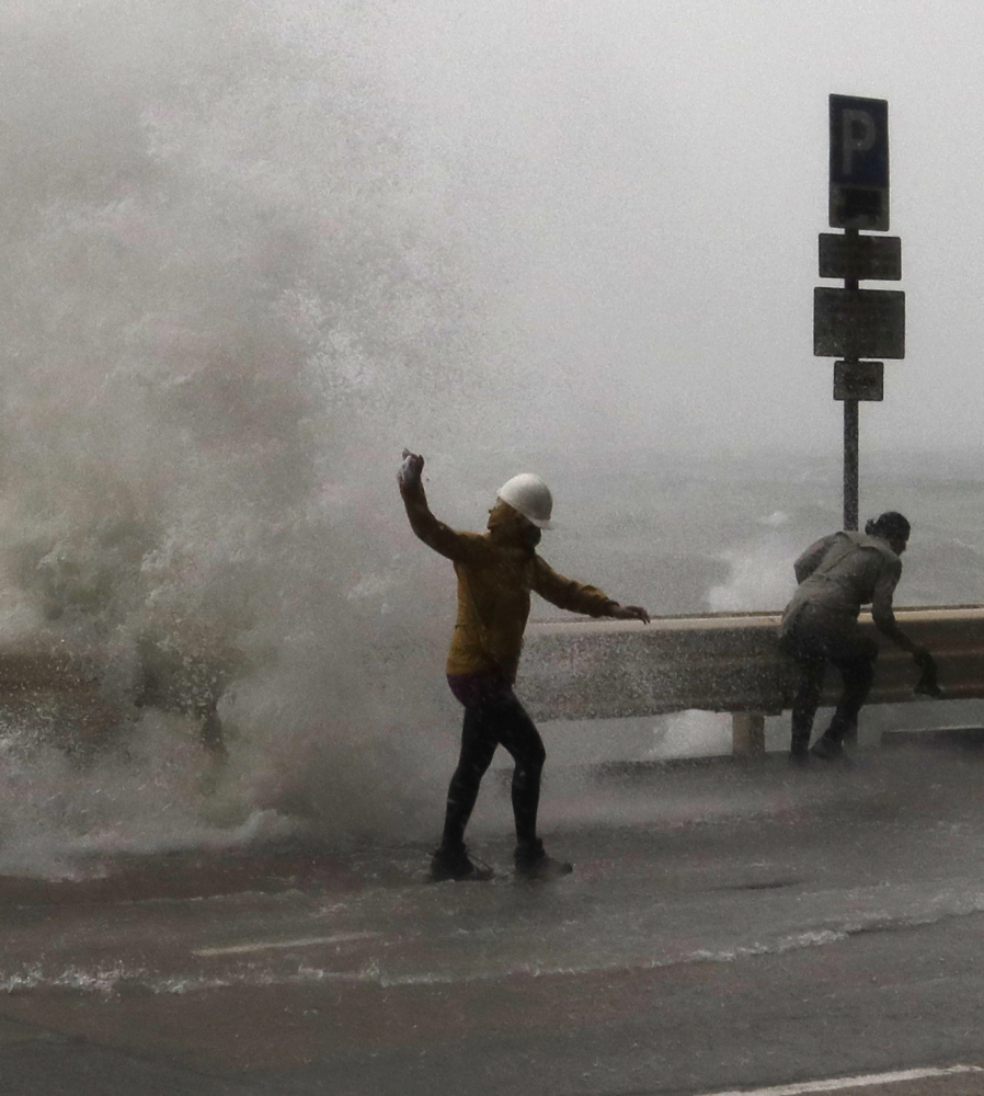 Waves caused by Typhoon Haima crash into Hong Kong. The storm headed toward southern China on Friday after hitting the Philippines.