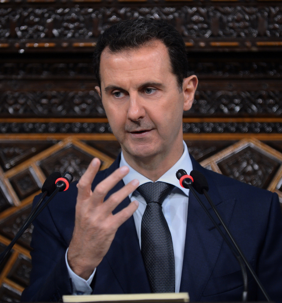 Bashar Assad, above, is essential to preventing Syria from falling under al-Qaida control, Russian President Vladimir Putin said Saturday.