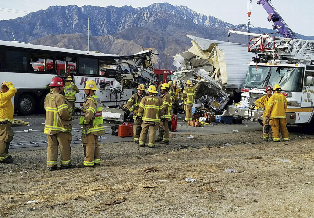 First responders work at the scene of a crash between a tour bus and a semi-truck on Interstate 10 near Desert Hot Springs, near Palm Springs, in California's Mojave Desert, on Sunday.