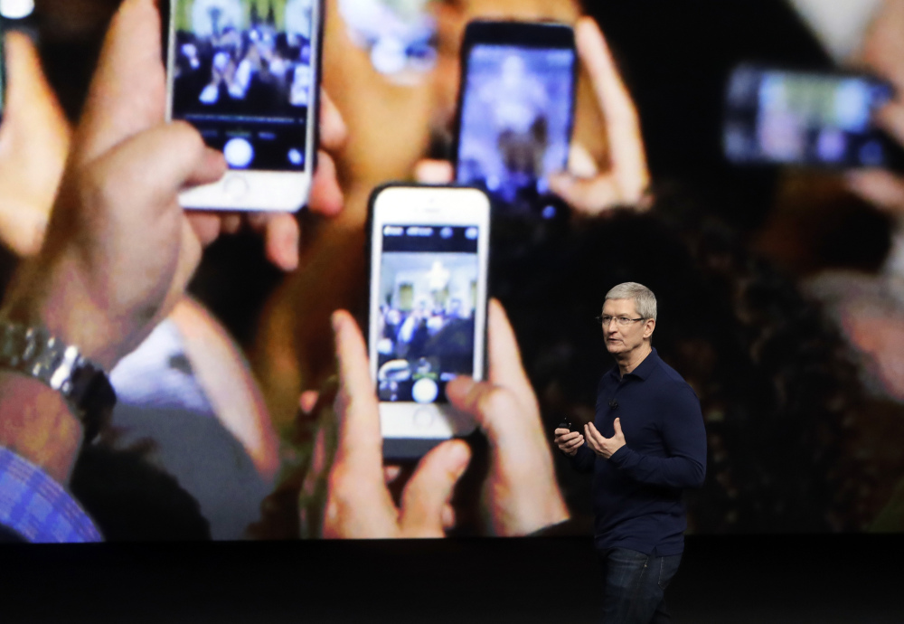 This October 2016 file photo shows Apple CEO Tim Cook, who emphasized growth in the company's services section as Apple reported that it sold 45.5 million iPhones in the previous quarter, 5 percent fewer than it sold a year earlier, in 2015.
