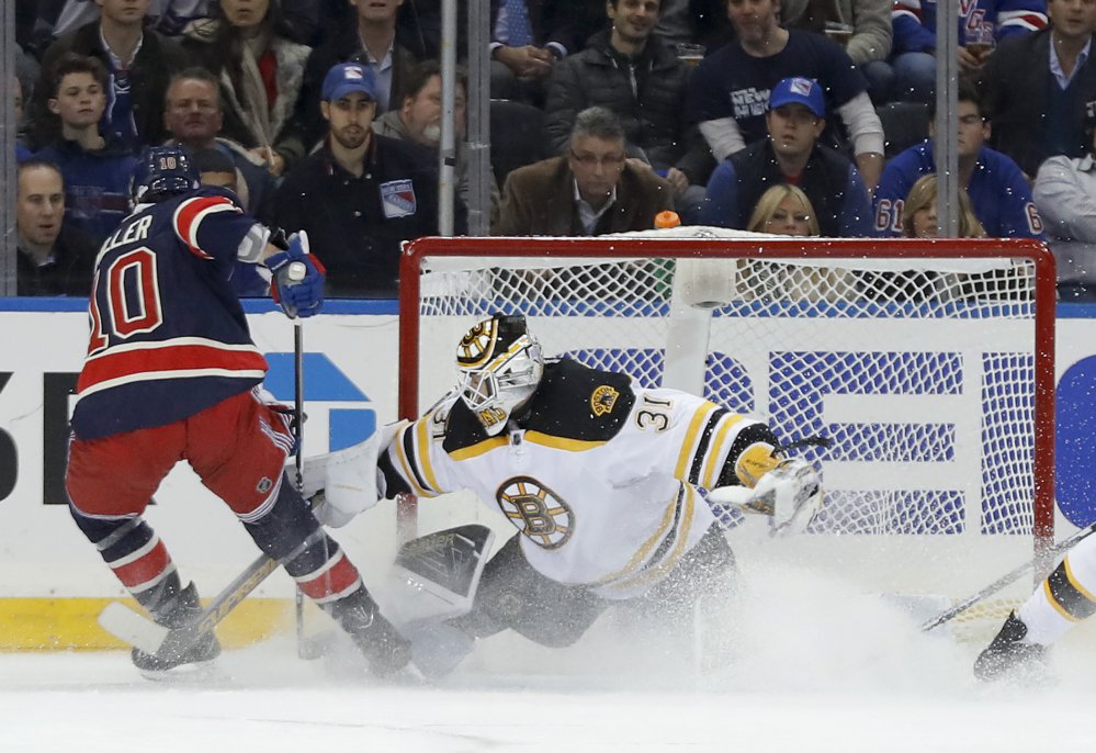 Bruins goalie Zane McIntyre makes a save on a shot by New York's J.T. Miller in the first period Wednesday night in New York.
