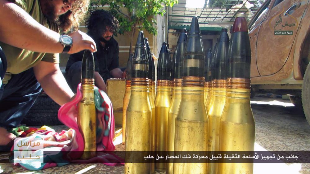 Photo released online Friday by the al-Qaida-linked Fatah al-Sham shows fighters preparing shells in the northern Syrian province of Aleppo.