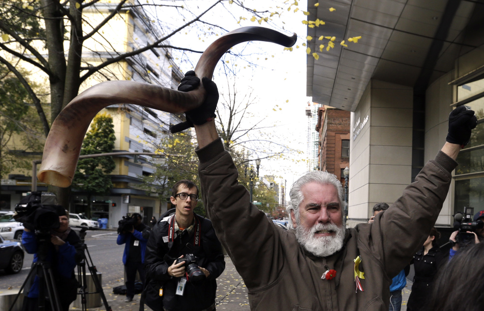 Brand Thornton celebrates outside the courthouse after hearing that the seven defendants were exonerated on conspiracy charges stemming from the Oregon standoff.