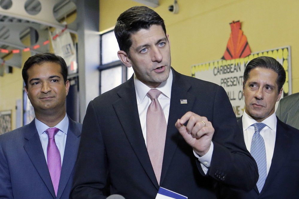 House Speaker Paul Ryan speaks as Rep. Carlos Curbelo, R-Fla., left, and Alberto Carvalho, superintendent of Miami-Dade County Public Schools, listen on Oct. 19 in Miami.