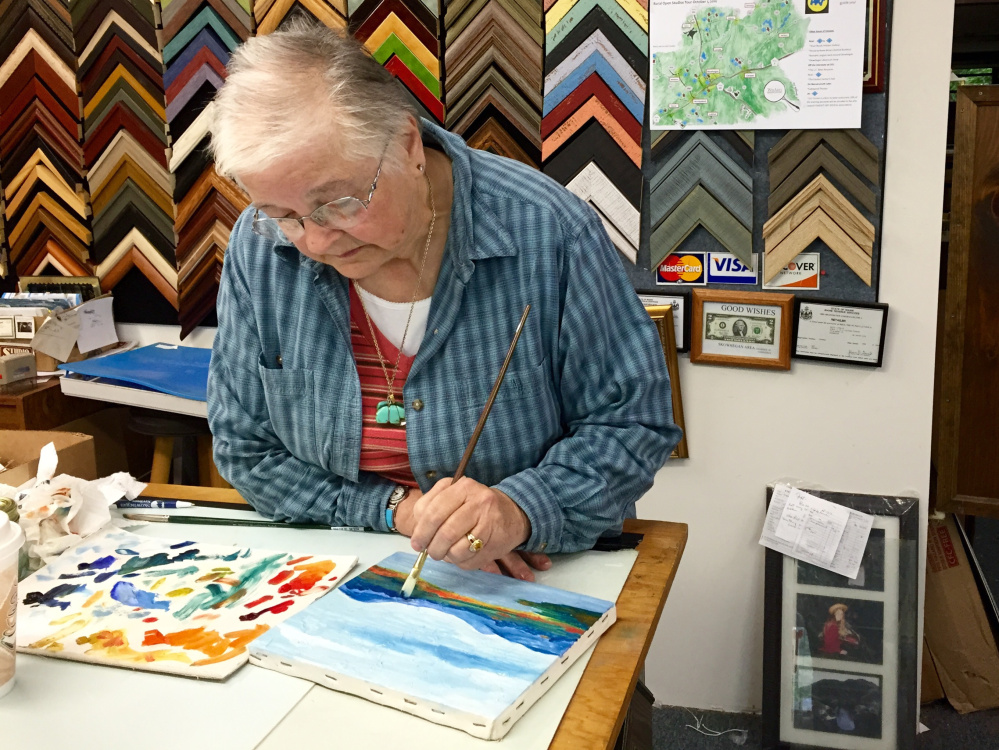 Linda Swift works on an oil painting Saturday at the Central Maine Artists' Gallery in Skowhegan during the Wesserunsett Arts Council's seventh annual Open Studio Tour.