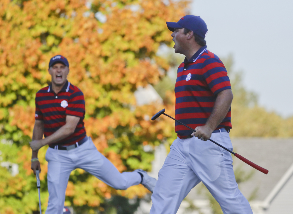 United States' Patrick Reed, right, celebrates his birdie on the 14th hole with teammate Jordan Spieth during a four-ball match at the Ryder Cup on Saturday at Hazeltine National Golf Club in Chaska, Minnesota.