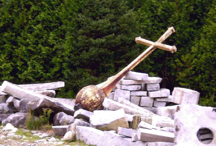 The cross that was atop the steeple of the former St. Francis de Sales Catholic Church on Elm Street in Waterville was left in a pasture in Albion, shown here, after the church was torn down in 2013. Pearley Lachance of Winslow learned where the cross had been left, rescued it from the field, is paying to have it restored, and plans to have it erected in St. Francis Catholic Cemetery off Grove Street in Waterville.