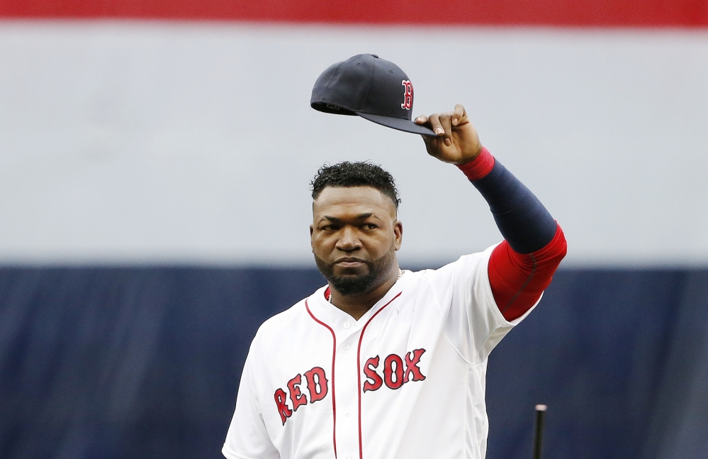 Boston's David Ortiz tips his cap to the crowd during ceremonies before Sunday's game at Fenway Park.