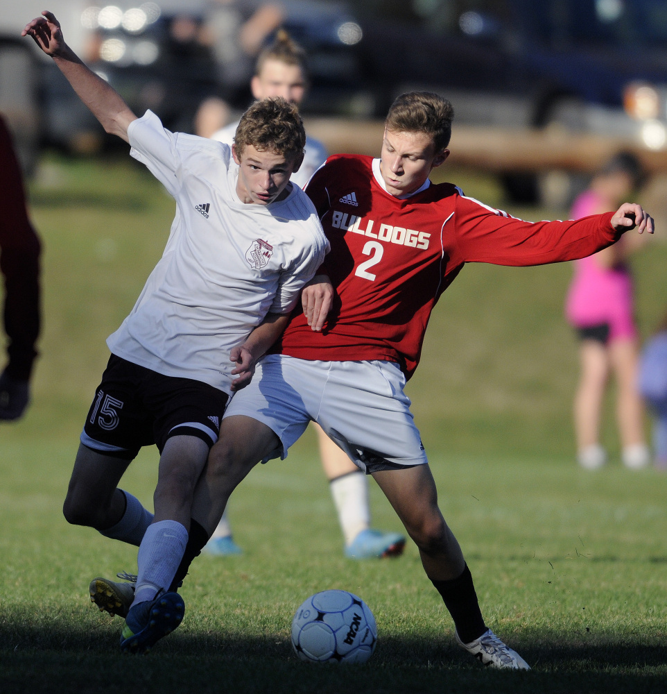 Monmouth's James Sampson, left, and Hall-Dale High's Eli Smith chase the ball during a soccer game Tuesday in Monmouth.