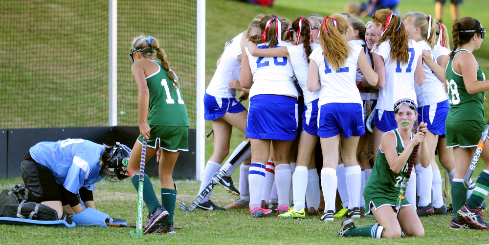 Winthrop field hockey players can only look on as Oak Hill celebrates a 2-1 double overtime victory Wednesday in Litchfield.