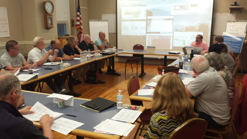 RSU 18's cost sharing committee listens as facilitator Rich Abramson begins the evening's discussion.