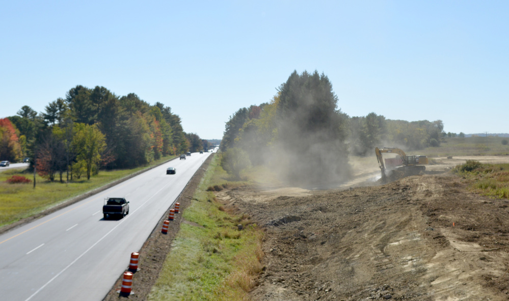 A construction crew works Friday afternoon on the southbound side of the future Trafton Road interchange at mile 124 on Intestate 95 in Waterville.