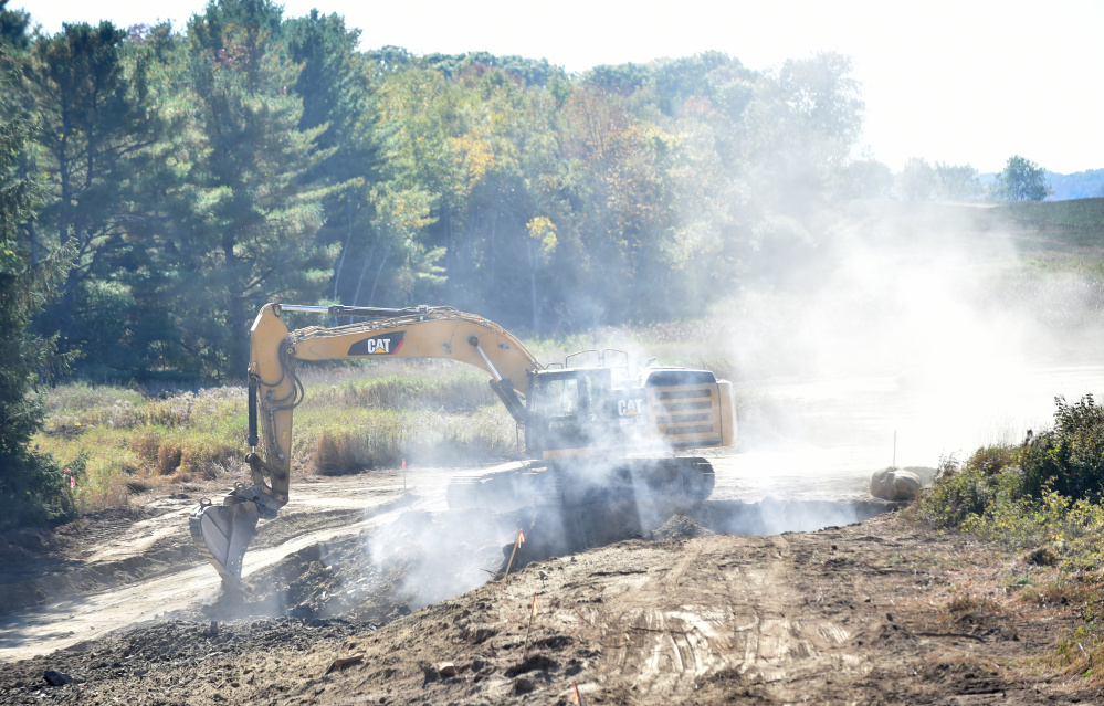 A construction crew works Friday afternoon on the southbound side of the future Trafton Road interchange at mile 124 on Intestate 95 in Waterville.