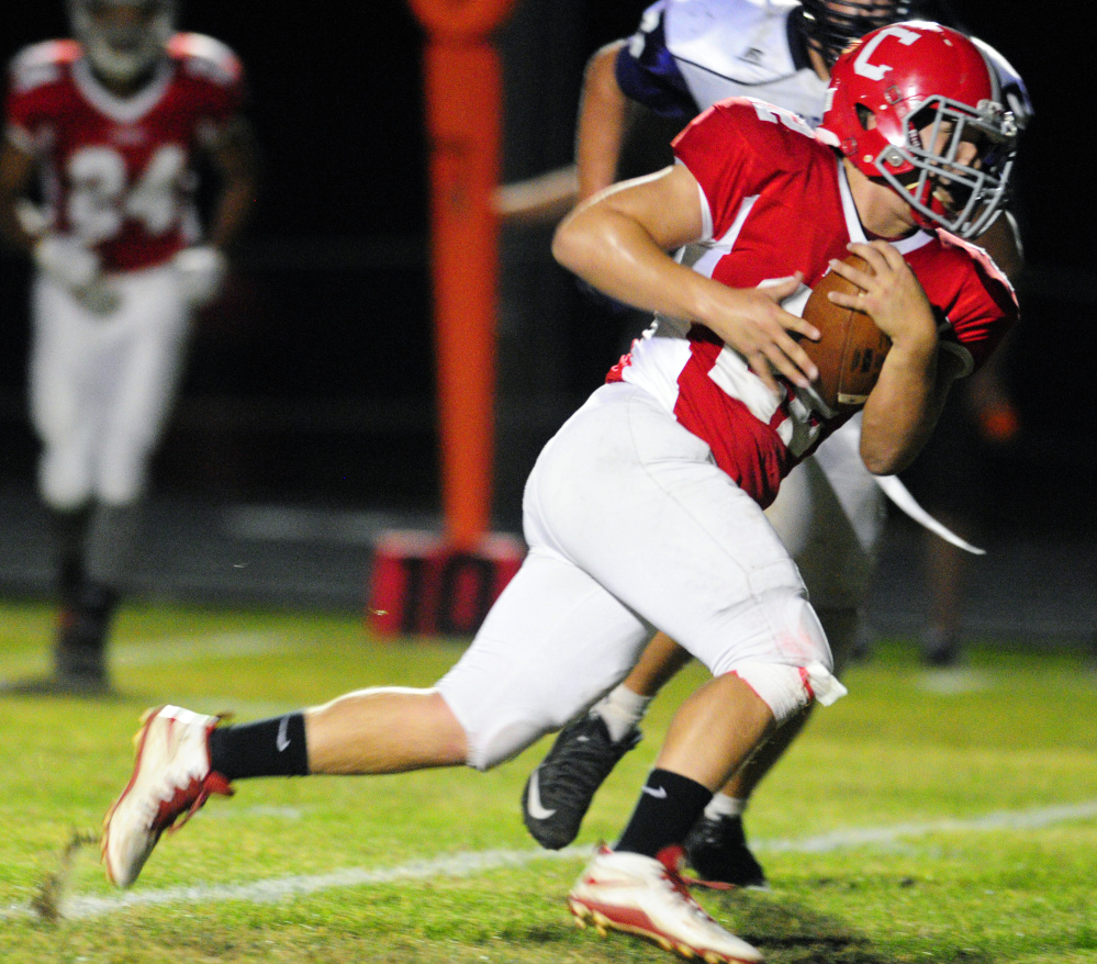 Cony's Chad Bickford runs the ball against Hampden during a Pine Tree Conference B game Friday in Augusta.