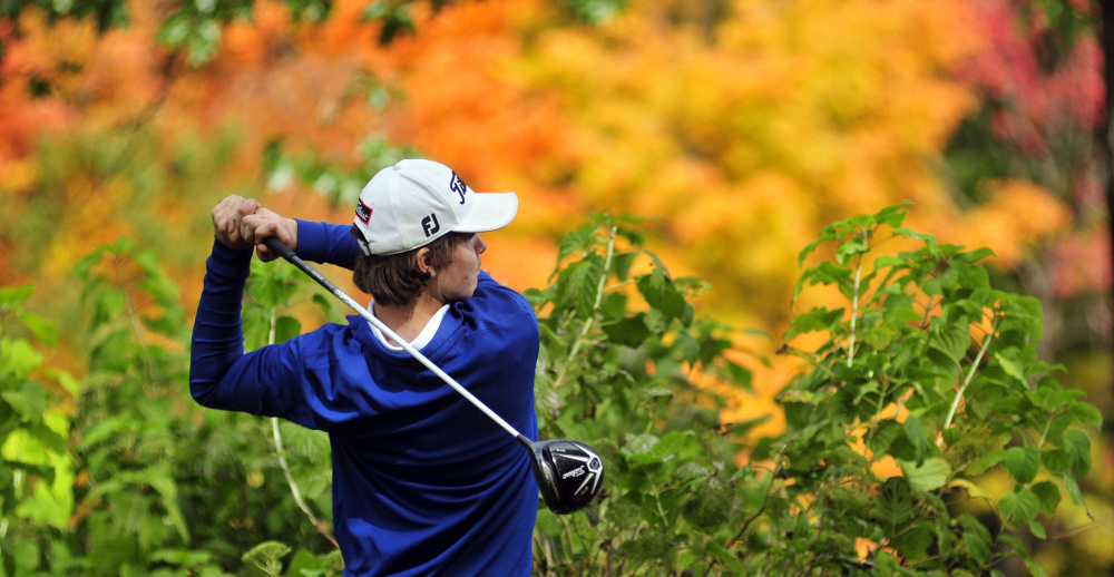 Staff photo by Joe Phelan 
 Erskine Academy golfer Connor Paine tees off on Arrowhead's 18th hole during the state team championship Saturday at Natanis Golf Course in Vassalboro.