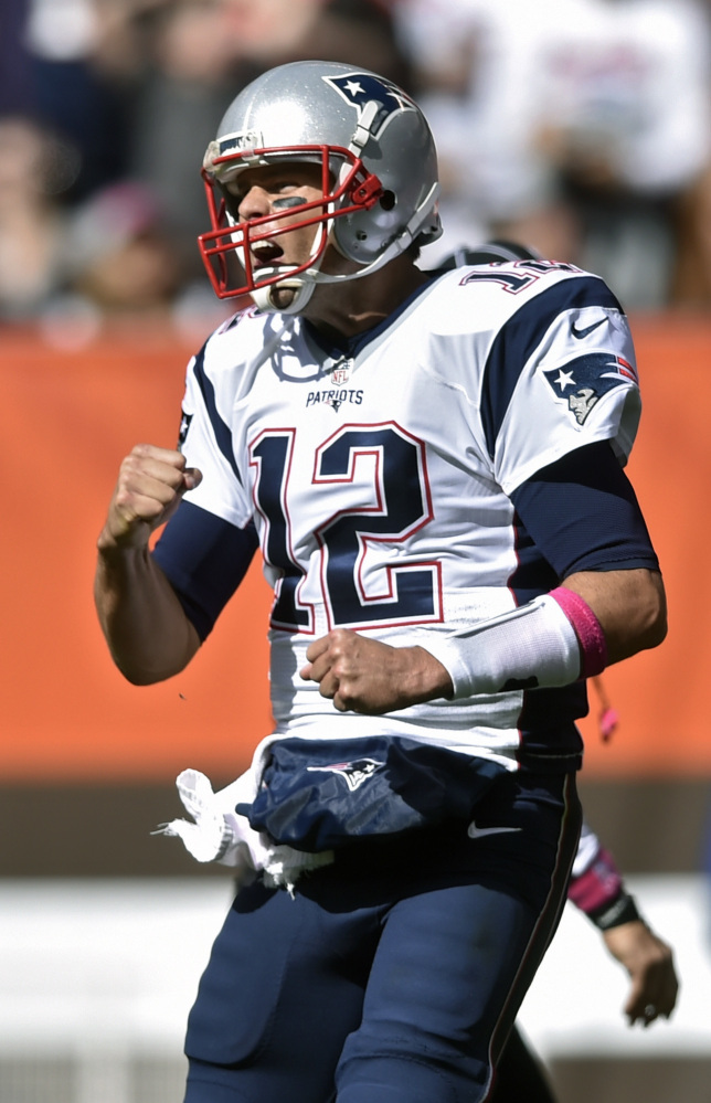 New England Patriots quarterback Tom Brady celebrates a touchdown in the first half against the Cleveland Browns on Sunday in Cleveland.