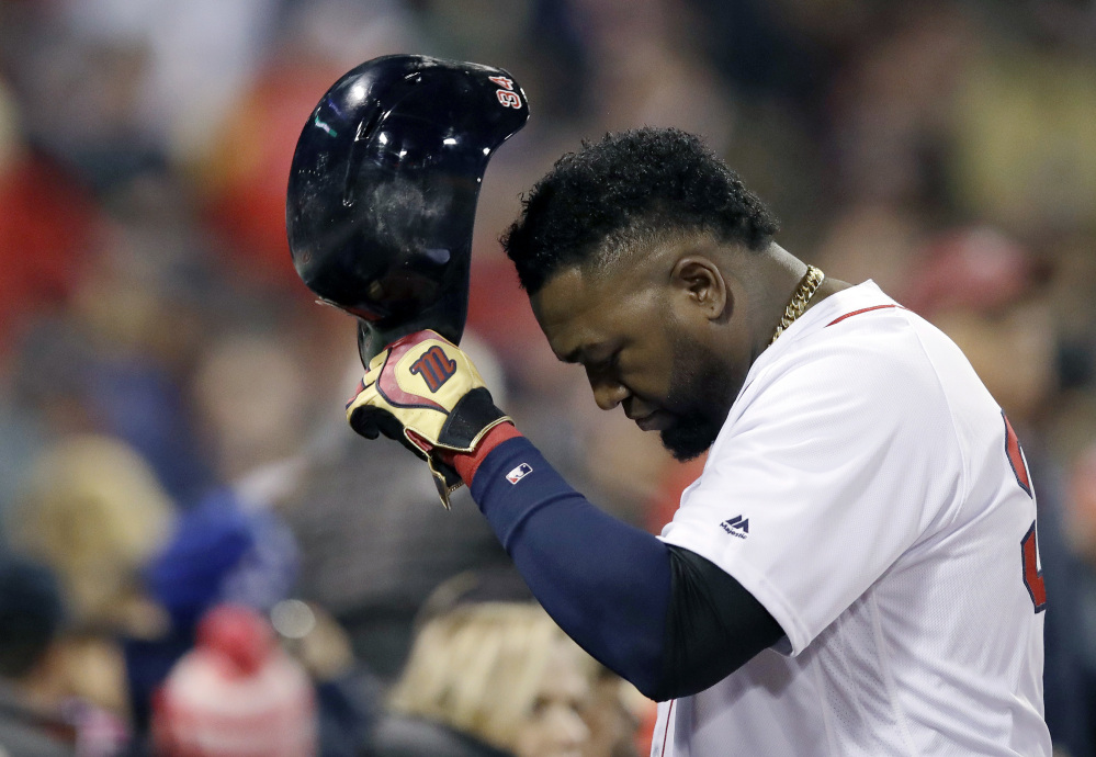 Red Sox designated hitter David Ortiz returns to the dugout after grounding out during the fourth inning in Game 3 of their American League Division Series against the Cleveland Indians on Monday in Boston.