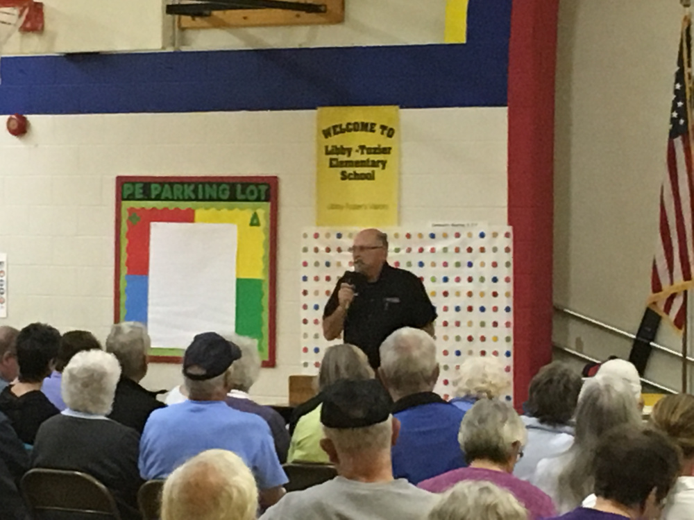 Mark Russell, chairman of the Litchfield Select Board, explains the difference between two proposed recall ordinances up for a vote at a special town meeting Tuesday night in Litchfield.